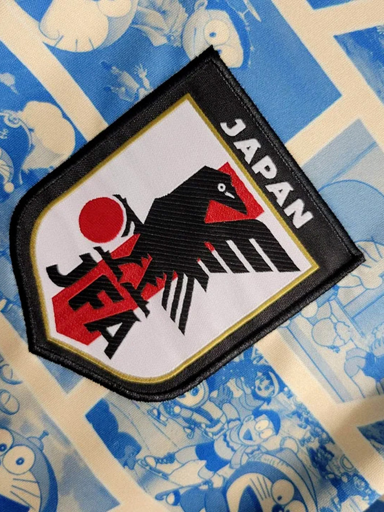 Logo du maillot du Japon Doraemon beige et bleu
