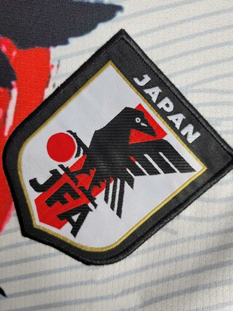 Logo du maillot du Japon avec un samouraï et le soleil-levant rouge en arrière-plan